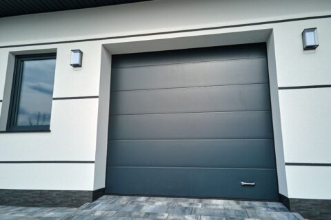 Modern home with closed black steel garage door in Seminole County, FL