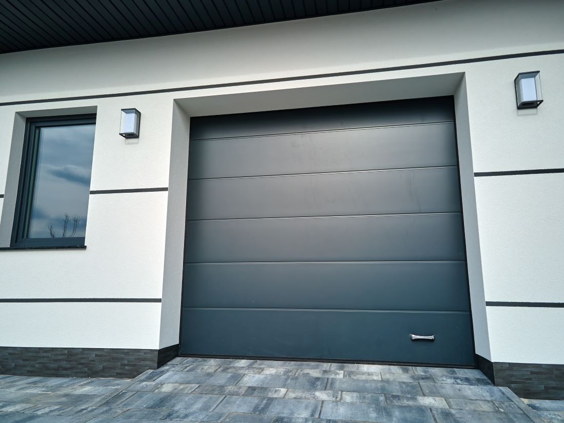 Modern home with closed black steel garage door in Seminole County, FL