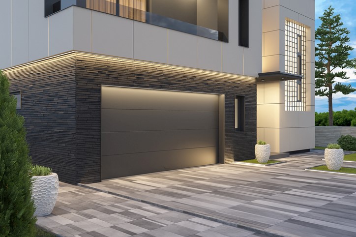 Modern luxury home with sleek gray garage door in Orlando and Central Florida