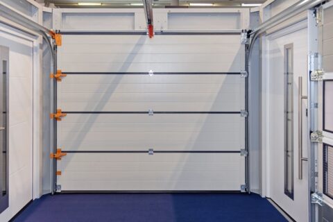 White sectional garage door in a showroom display in Orlando & Central FL