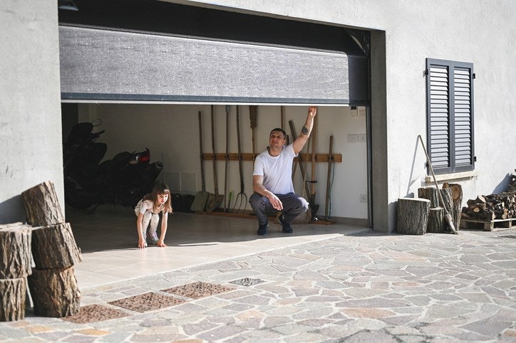 Man and child inside an open garage in Orlando & Central FL